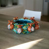 Picture of centerpiece with pomegranates and leaves